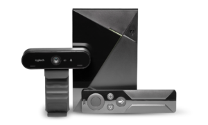 Image of a webcam and OneVP device with a remote control.