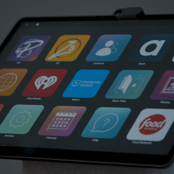 A close up image of a tablet with many app icons on the screen.