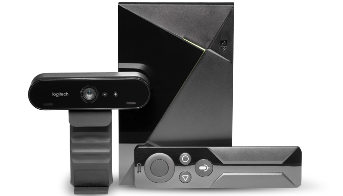 Image of a webcam and OneVP device with a remote control.