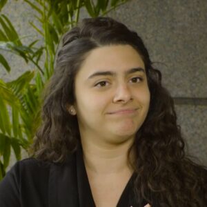 Vanessa Perez Image of ZP employee Amanda Perez. She has brown curly hair and is wearing a black v-neck blouse.